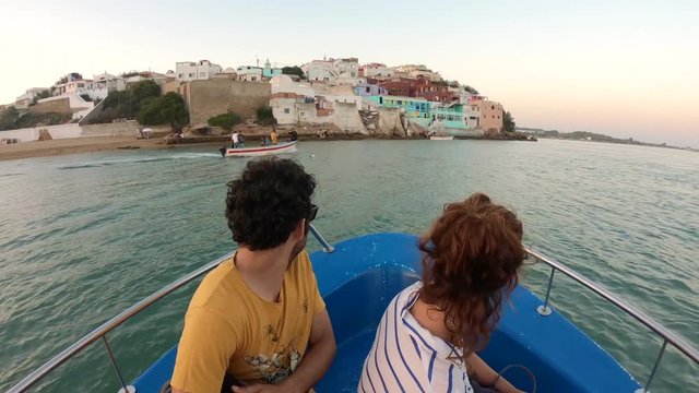 Adventurous couple travel by boat to a small town on the Moroccan coast, Moulay Bousselham