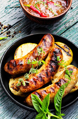 Grilled sausages in frying pan