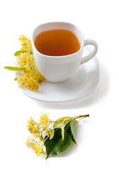 Green herbal tea  with linden flowers isolated on white background