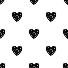 Valentine's Day seamless pattern with small black glitter hearts on white background