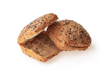 Freshly baked sesame seed burger bun isolated on a white background