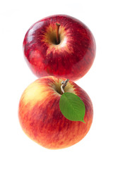 Two red apple with green leaf isolated on white background.