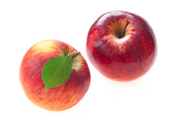 Red apple with apple leaf on a white background.