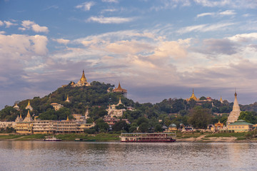 Pagodas gleam on the serene riverbanks of the Irrawaddy in Myanmar