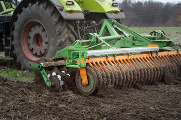 The disk harrow. Tractor blades for plowing land in the agriculture industry. Agricultural...