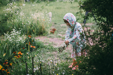 little girl gardening in the garden