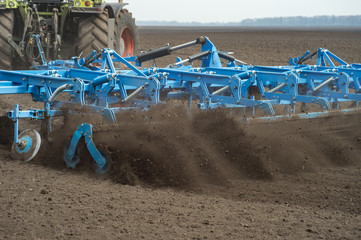 tractor preparing land with seedbed cultivator as part of pre seeding activities