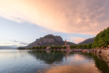 Fototapeta na wymiar Shining panorama of Lecco Lake at the sunset with huge colorful cloud