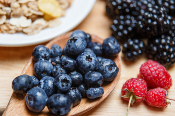 Fresh organic blueberries and raspberries in a basket.Blueberry and raspberry