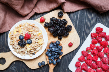 Cereal. Breakfast with muesli and berries. Top view, flat lay