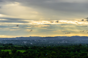 Landscape of cloudy, mountain and forest with sunset in the evening from top view.