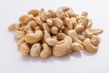 cashew nuts on a white acrylic background