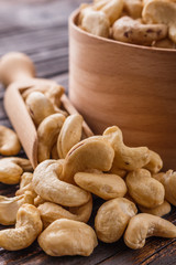 cashew nuts on a rustic wooden background