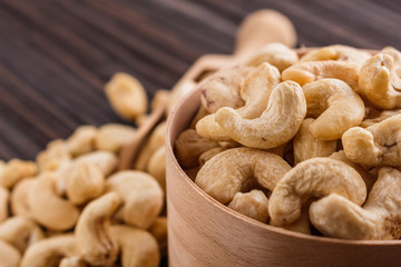 cashew nuts on a rustic wooden background