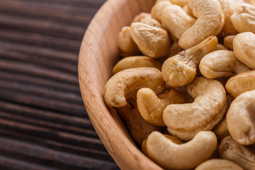 cashew nuts on a rustic wooden background