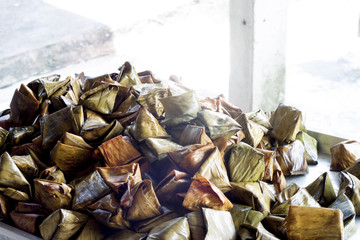 Stuffed Dough Pyramid Wrapped with banana leaves for Chinese New Year or Thai religious holidays.