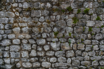 Ancient stone wall in an italian medieval city. Also usable as background, wallpaper or screensaver