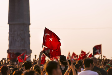 Turkish flag in crowded people.