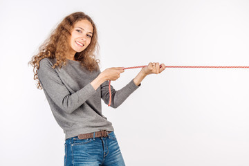 Woman pulling a rope