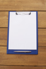 Clipboard and pen with empty paper
