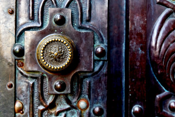 Old metal door with a old door knob in Spain