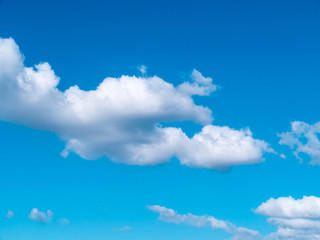 Light in the clouds on blue sky, The stormy and fluffy clouds shined from above with the sunlight, view from airplane Windows.