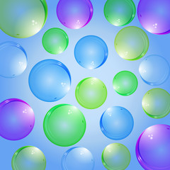 Isolated colorful realistic glass bubbles with reflection on a colored background. Isolated blowing bubbles for your design.