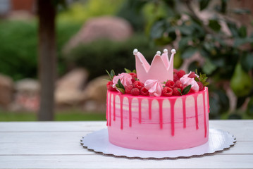 pink cake with crown on birthday