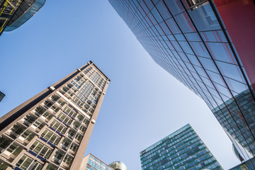 Fototapeta premium Tall modern buildings with smooth reflections in the windows. Hamburg, Germany.