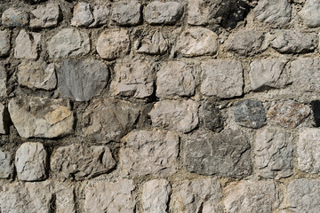Ancient stone wall in an italian medieval city. Also usable as background, wallpaper or screensaver
