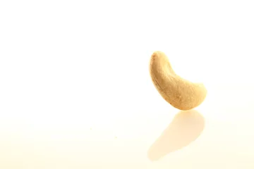 Poster Cashew nut on white background © taffpixture