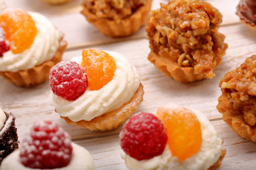 Catering sweets, closeup of various kinds of cakes on event or wedding reception