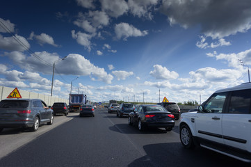 Fototapeta premium Traffic on the highway with metal safety barrier