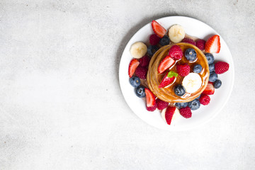 Delicious pancakes with fruit