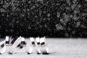 Christmas holidays background with silver ribbon