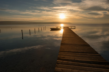 Obraz na płótnie Canvas Seascape during sunset. Beautiful natural seascape, blue hour. Sea sunset at the Black sea coast near Balchik, Varna, Bulgaria. Magnificent sunset with clouds and rocks.