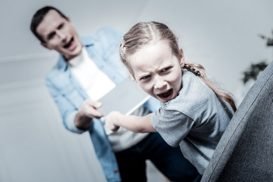 Difficult Kids. Naughty Girl Irrittating Parents While Being Selfish