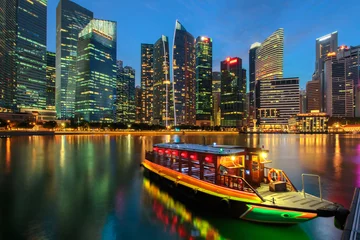 Peel and stick wall murals Singapore Singapore city skyline. Excursion cruise boat and business district view. downtown reflected in water at dusk in Marina Bay. Travel cityscape