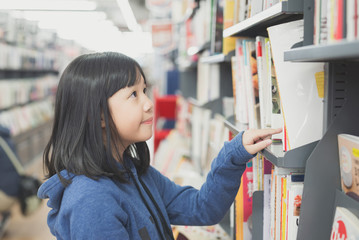 Asian girl in a bookstore