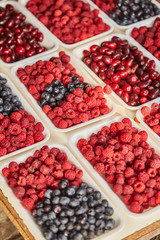 market. Sale of berries. Sale of raspberry in trays