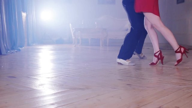 Legs stepping into tango dance