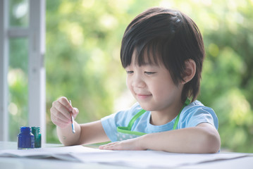 boy painting a picture