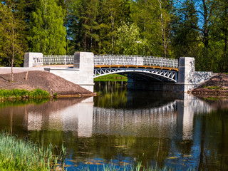 Stone bridge over the river in the park
