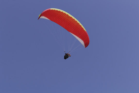 Paraplane on the blue sky background, leisure activity.