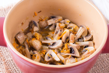 Mushrooms stewed with vegetables in a saucepan