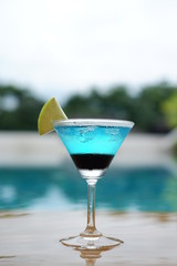Blue daiquiri cocktails at swimming pool