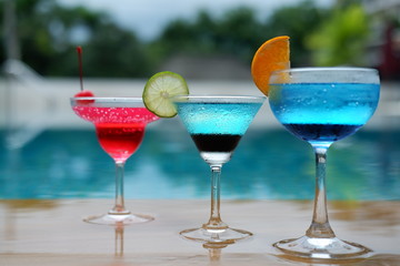 colorful summer drinks at swimming pool