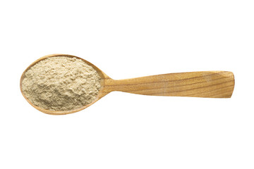 cardamom powder in wooden spoon isolated on white background. spice for cooking food, top view.