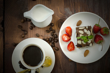 Coffee beans, glass and equipment for drinking coffee with warm light