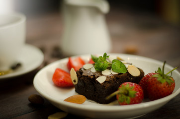 Chocolate brownie, strawberry and coffee with casual day